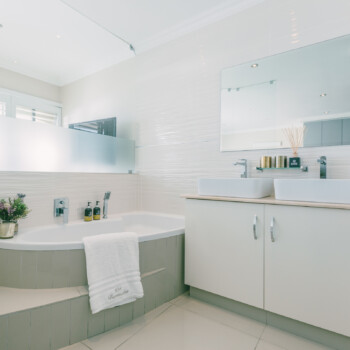 The sparkling and bright upstairs guest bathroom.