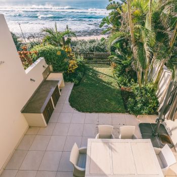 Feel on top of the world as you overlook your private garden patio that leads directly to the beach.